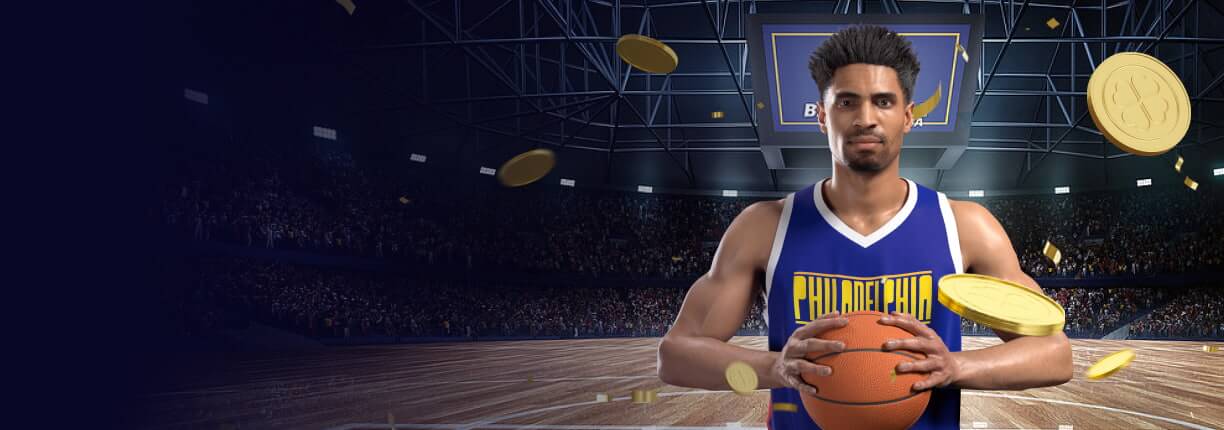 นักบาสเก็ตบอลที่มีผิวสีน้ำตาลกำลังถือลูกบอลด้วยมือทั้งสองข้างโดยสวมเสื้อเจอร์ซีย์สีน้ำเงินที่มีคำว่า "ฟิลาเดลเฟีย" เขียนอยู่